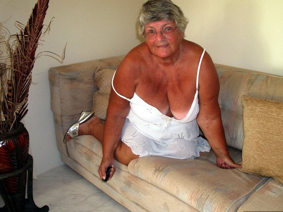 20P Fat lady Grandma Libby bares her saggy tits and big ass while on a couch