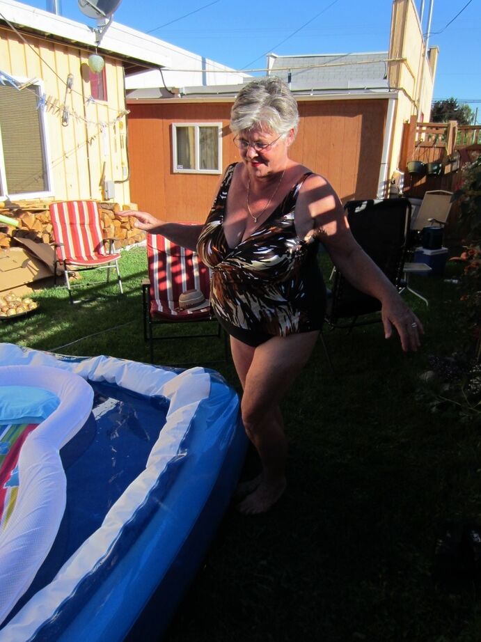 20P Fatty mature granny Girdle Goddess peels to enjoy wading pool skinny dip