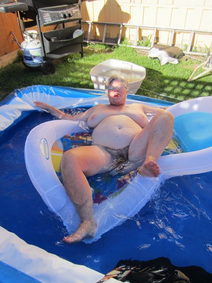 20P Fatty mature granny Girdle Goddess peels to enjoy wading pool skinny dip