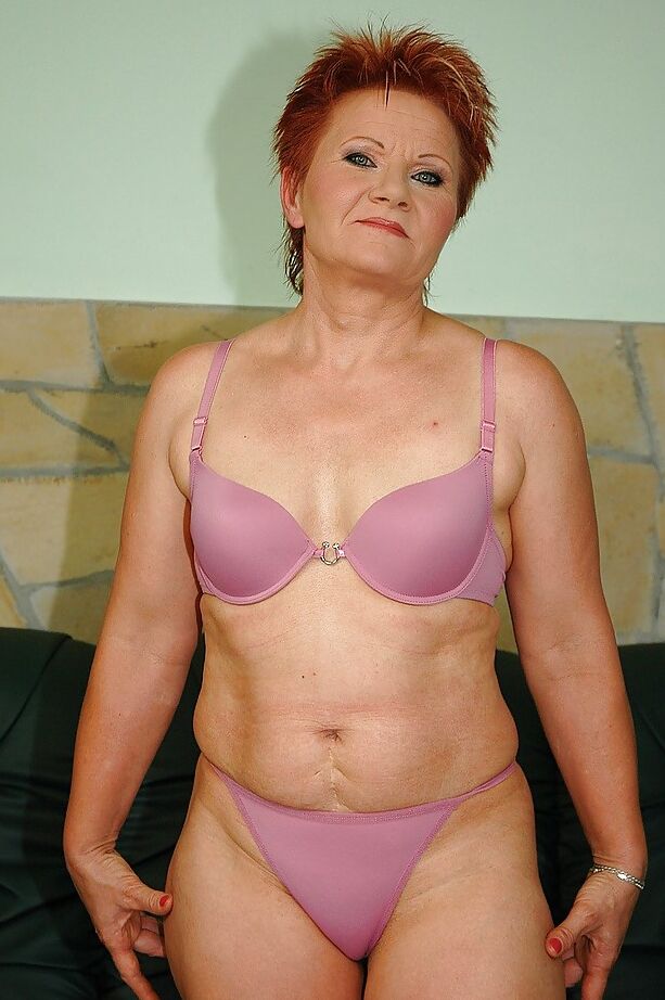 16P Redhead granny with tiny tits shows her shaved cunt and her hot ass