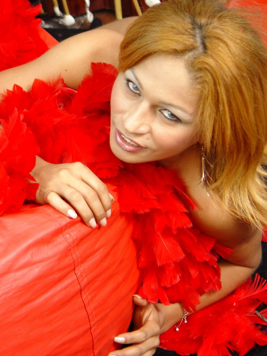 21P Redheaded shemale Fabricia Moreno teasing with her hard dick in nylons