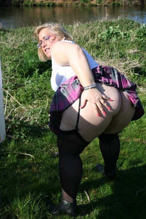20P Fat amateur Lexie Vummings wears an anal plug during upskirt action by a river