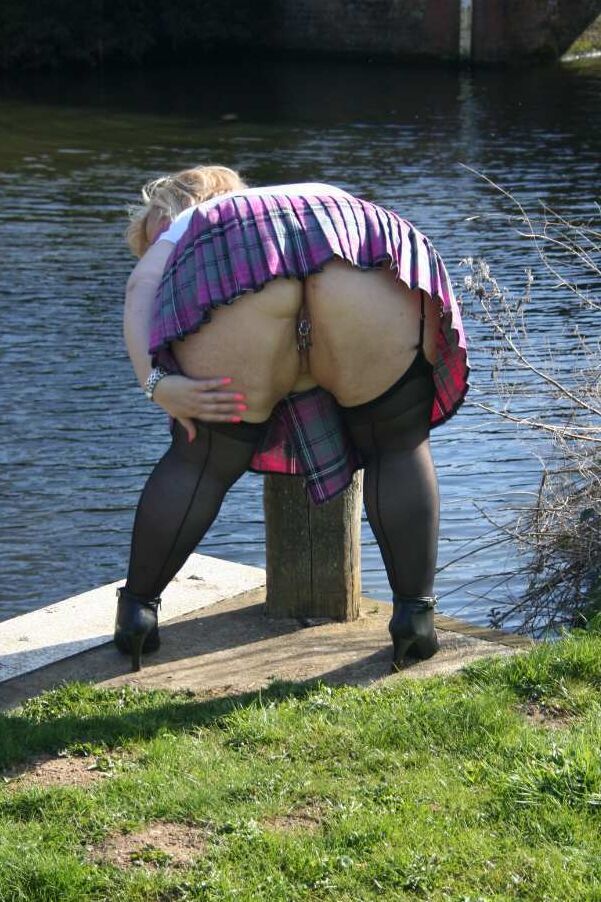 20P Fat amateur Lexie Vummings wears an anal plug during upskirt action by a river
