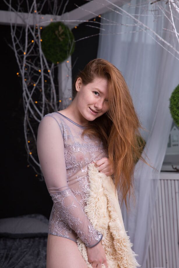 16P Natural redhead Anika B removes a bodysuit before showcasing her trimmed pussy