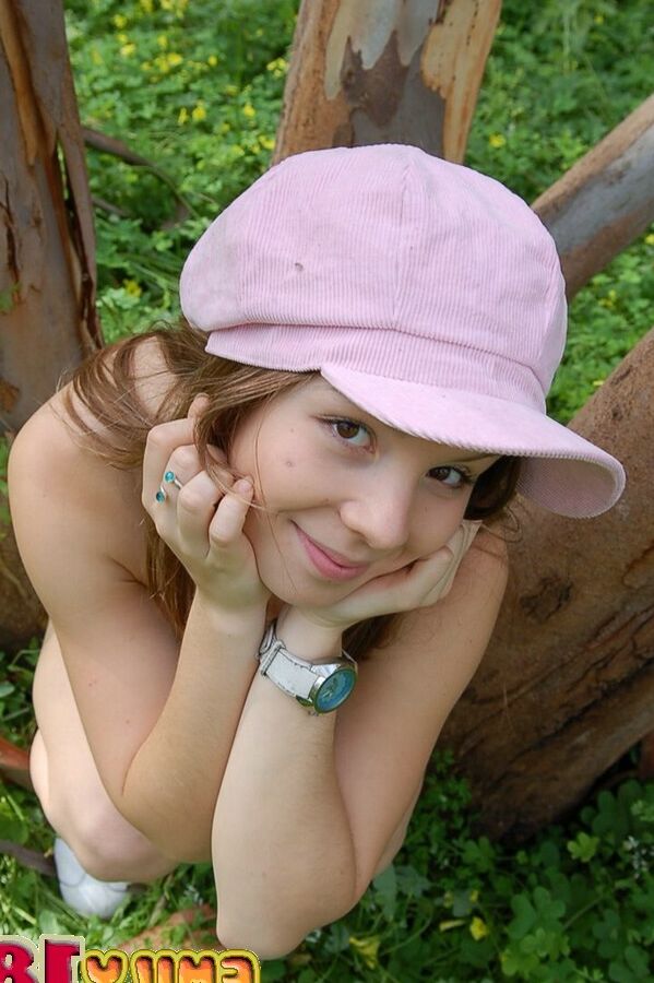 15P Playful sweet Emily climbs on the trees while taking her clothes off