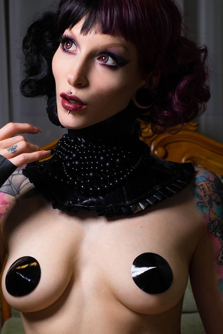 15P Skinny alt girl Razor Candi plays with Ben Wah balls during a solo gig