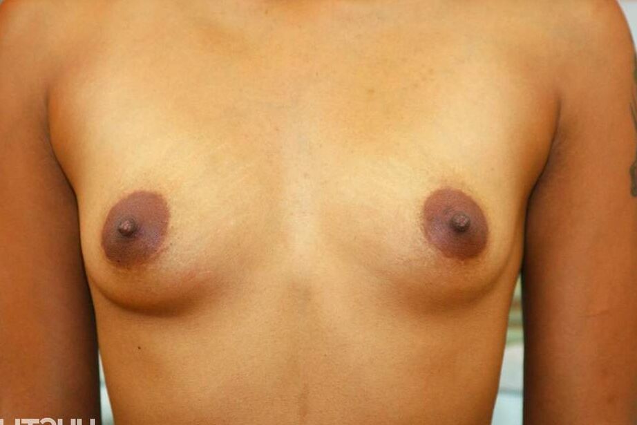 16P Black solo model Absolute Star holds her small tits as she partially strips