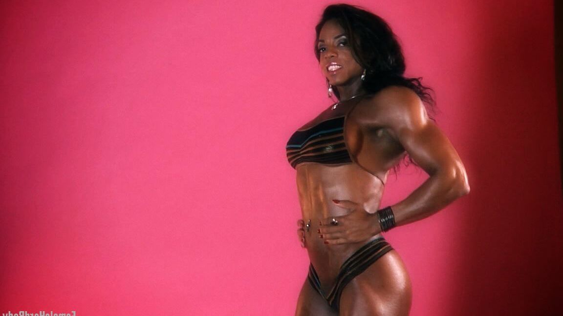 15P Black bodybuilder Alexis Ellis bares her tight ass while flexing her muscles