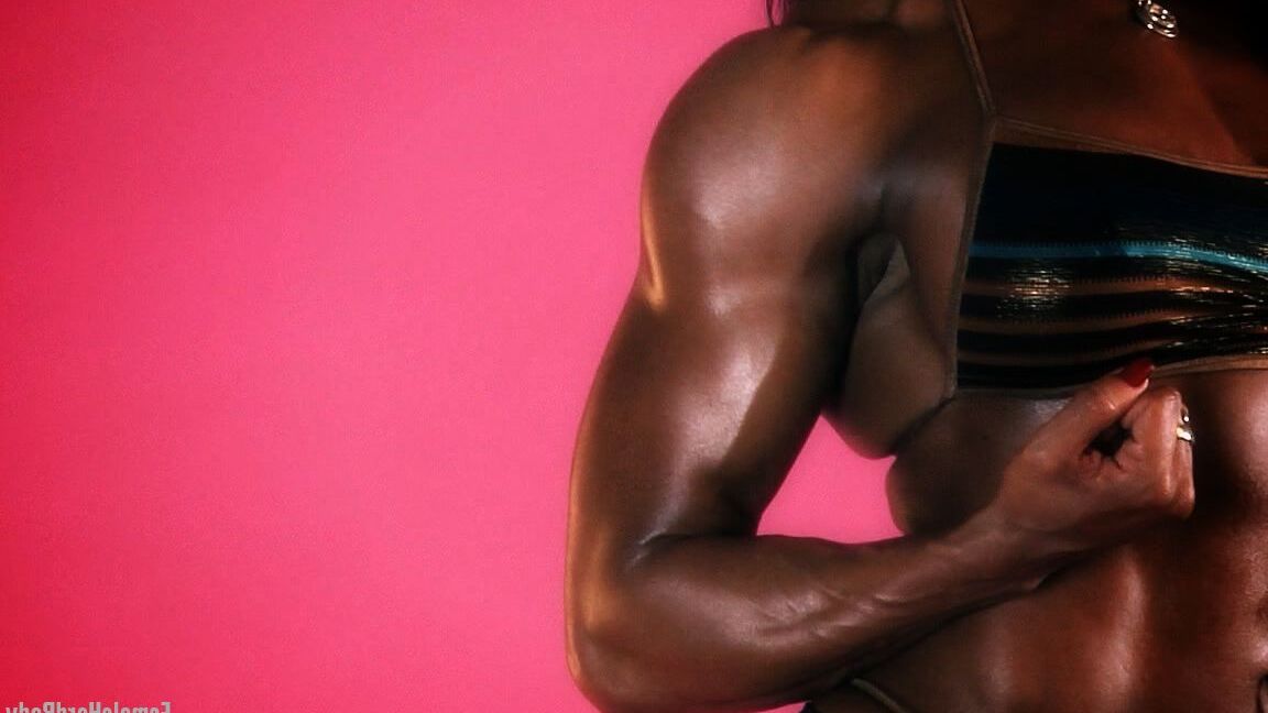 15P Black bodybuilder Alexis Ellis bares her tight ass while flexing her muscles