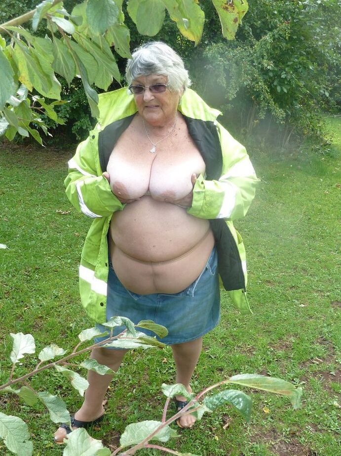20P Fat British woman Grandma Libby exposes herself by a tree in a park