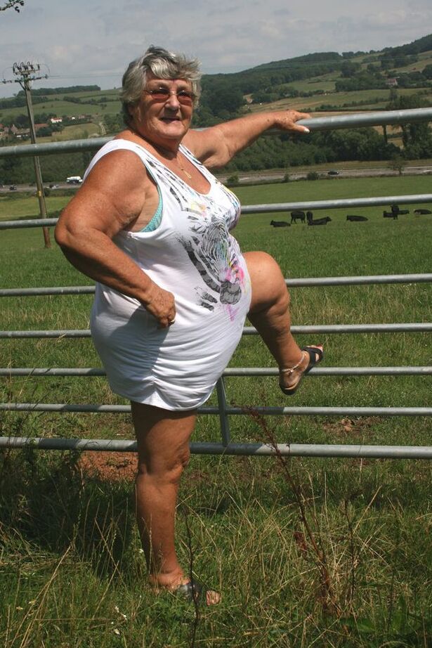 20P Old British woman Grandma Libby exposes herself next to a field of cattle