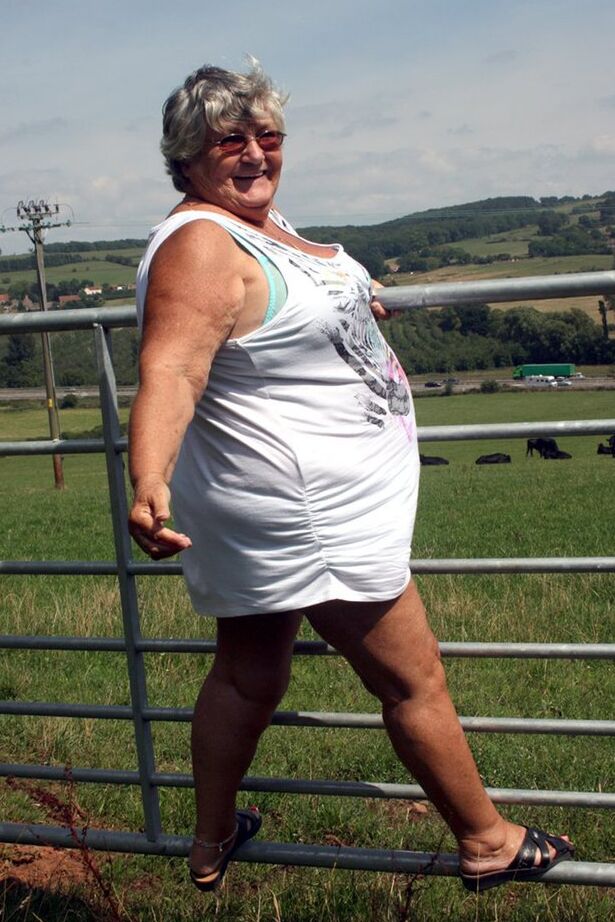 20P Old British woman Grandma Libby exposes herself next to a field of cattle