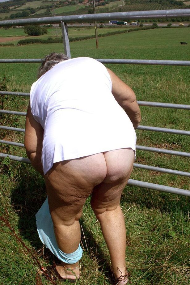 20P Old British woman Grandma Libby exposes herself next to a field of cattle