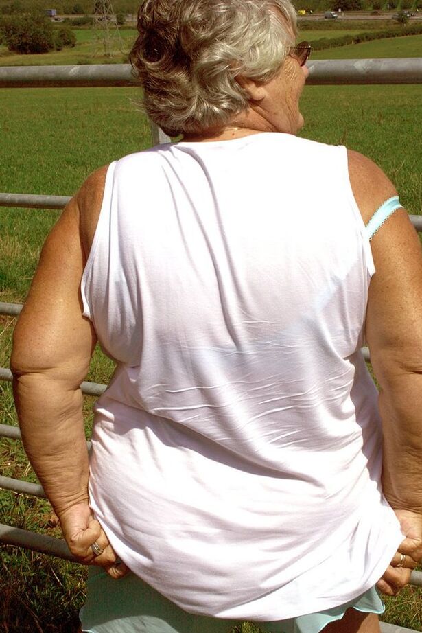 20P Old British woman Grandma Libby exposes herself next to a field of cattle