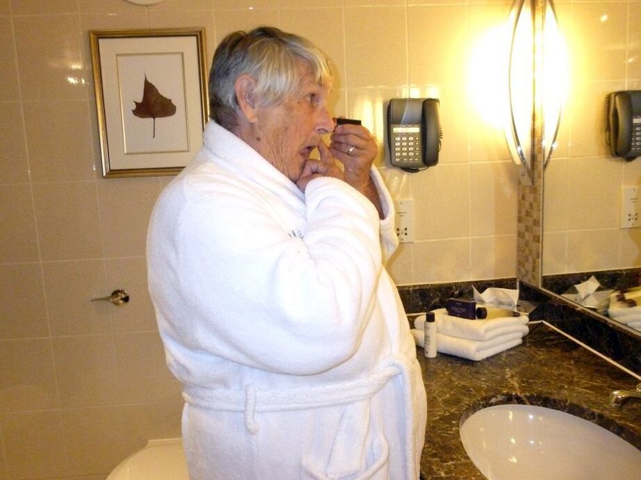 20P Fat nan Grandma Libby removes a bathrobe to pose nude in a cupless bra
