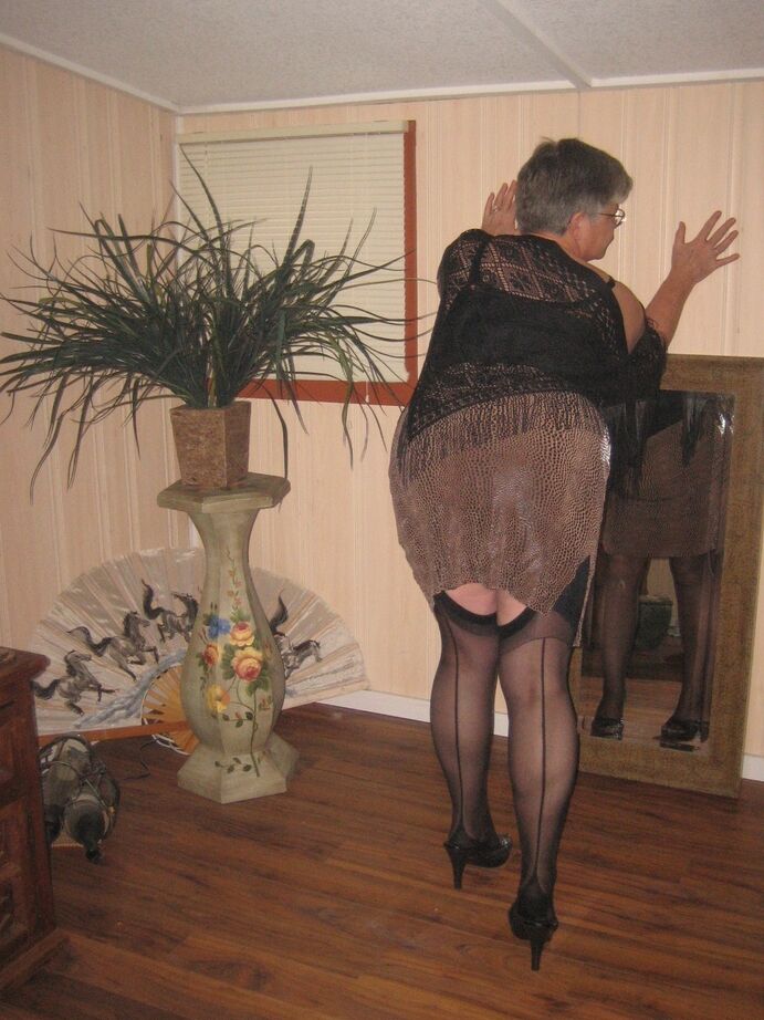 20P Fat granny unleashes her huge breasts before flashing no panty upskirt
