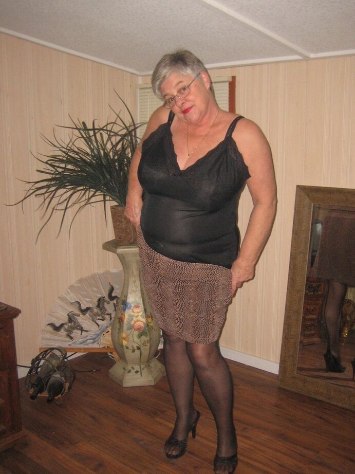 20P Fat granny unleashes her huge breasts before flashing no panty upskirt