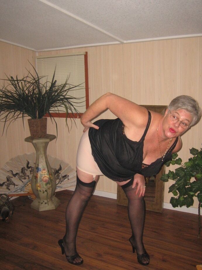 20P Fat granny unleashes her huge breasts before flashing no panty upskirt