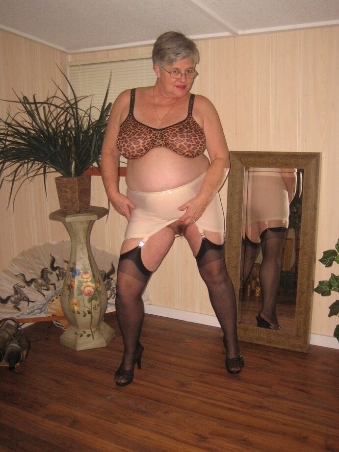 20P Fat granny unleashes her huge breasts before flashing no panty upskirt
