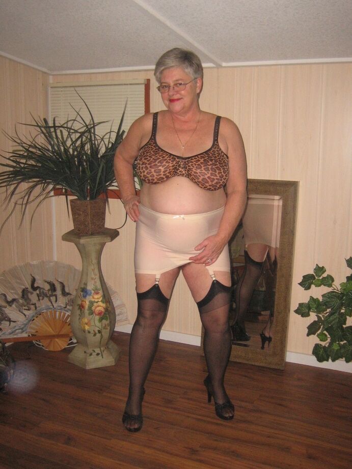 20P Fat granny unleashes her huge breasts before flashing no panty upskirt
