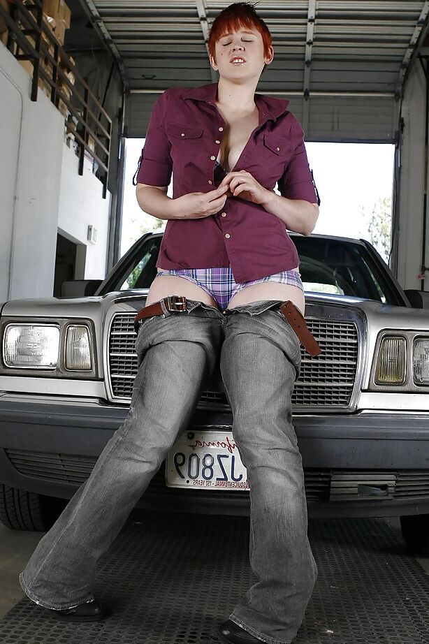 16P Short-haired redhead in jeans slowly uncovering her curvy body