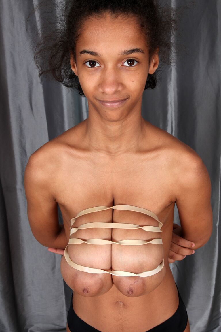 21P Ebony Addisson shows off her huge breasts and squeezes them in undies