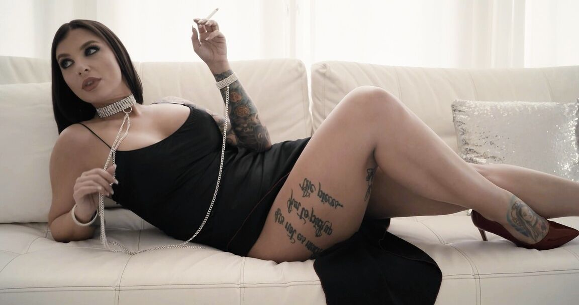 15P The luscious Ivy Lebelle, decked out in a skintight black mini dress and razor