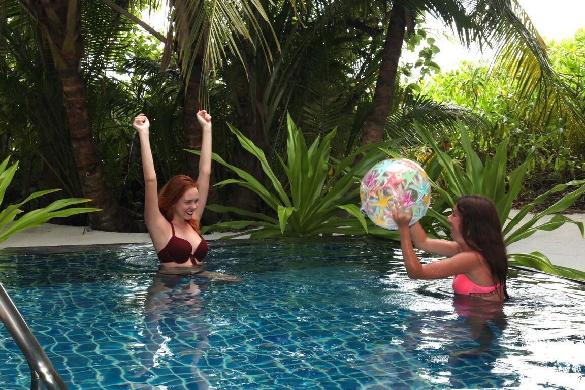 21P Sultry teens Candy P & Katty West strip and fuck each other in the pool