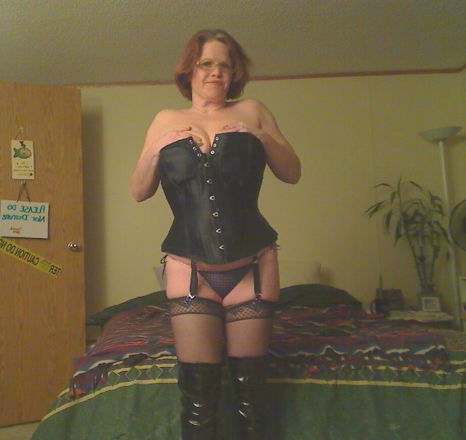 19P Redheaded amateur Misha MILF looses her large tits from a corset in OTK boots