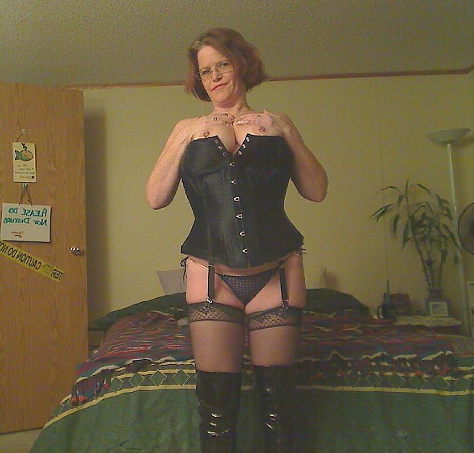 19P Redheaded amateur Misha MILF looses her large tits from a corset in OTK boots
