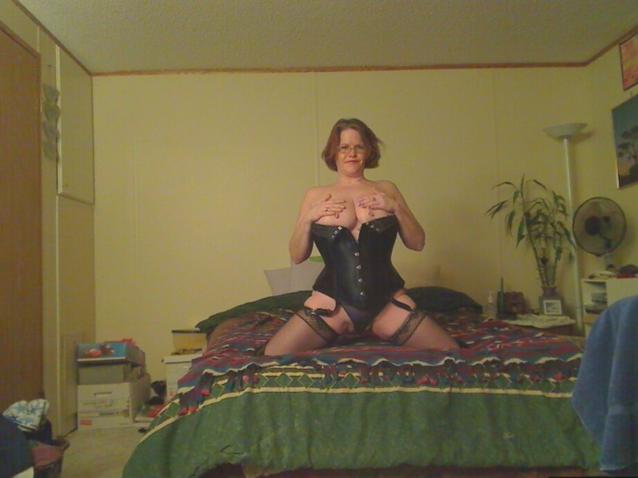 19P Redheaded amateur Misha MILF looses her large tits from a corset in OTK boots