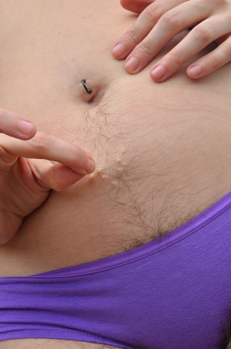 21P Curvy amateur slut Harley Hex strips and exposes her hairy body in a field