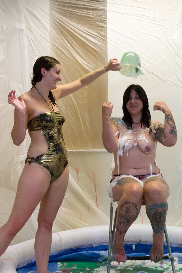 20P Amateur lesbians douse each other in gunk while in a wading pool