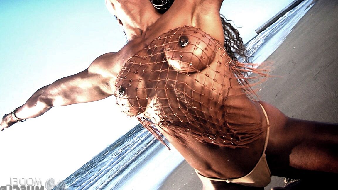 21P Bodybuilder Alexis Ellis shows her six pack and pierced nipples on the beach