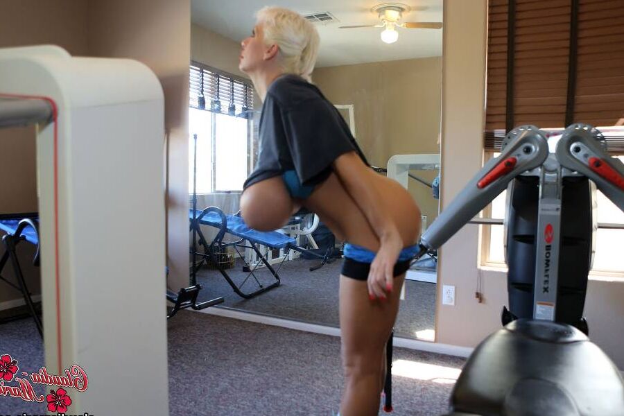 12P Huge fake tits Claudia Marie working out in the gym with her big udders
