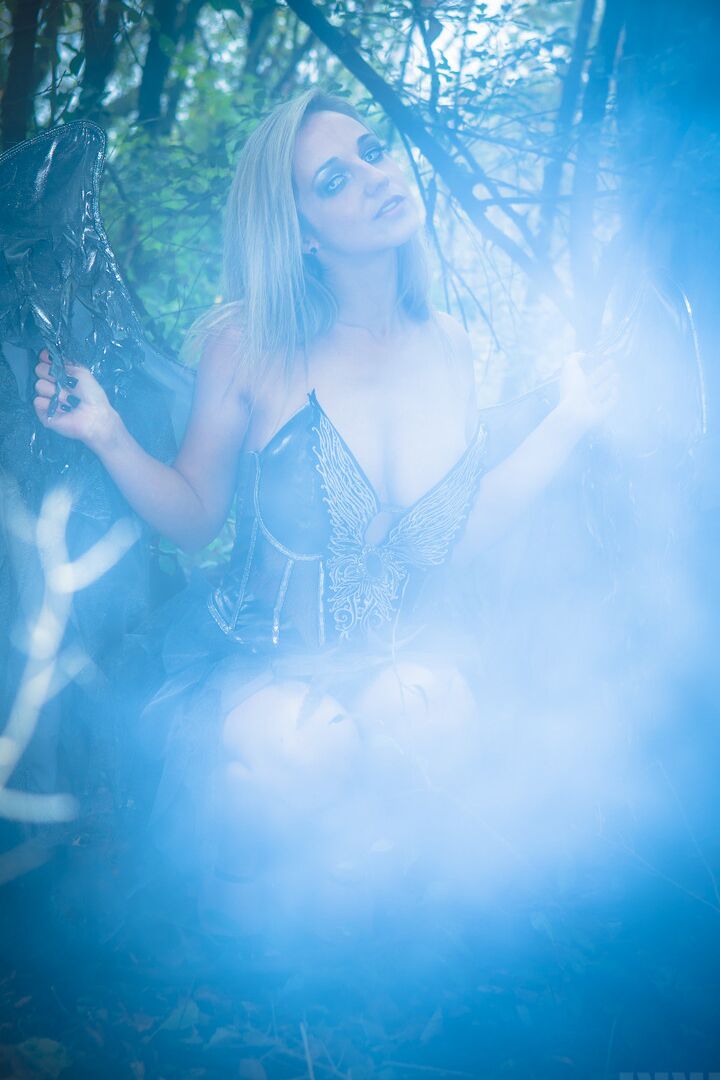 15P Fairy cosplay girl Nikki Sims doffs her wings and wisp to pose in a thong