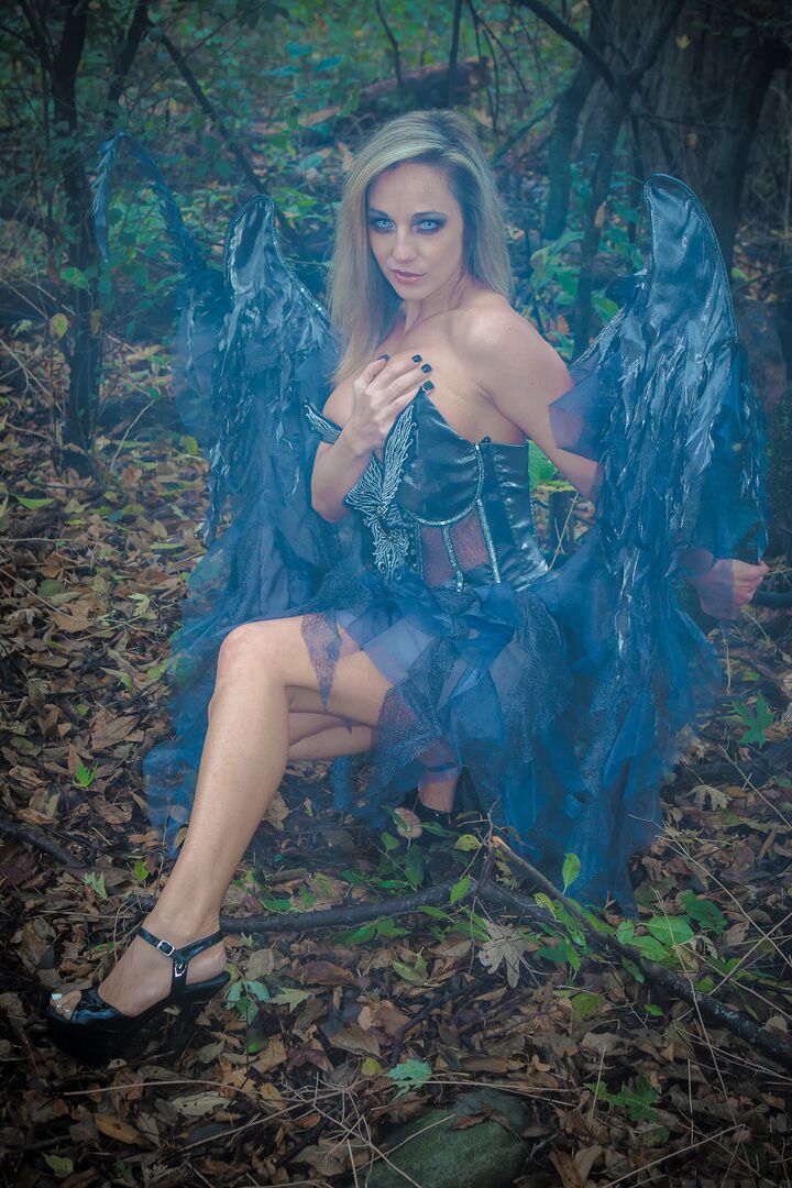 15P Fairy cosplay girl Nikki Sims doffs her wings and wisp to pose in a thong