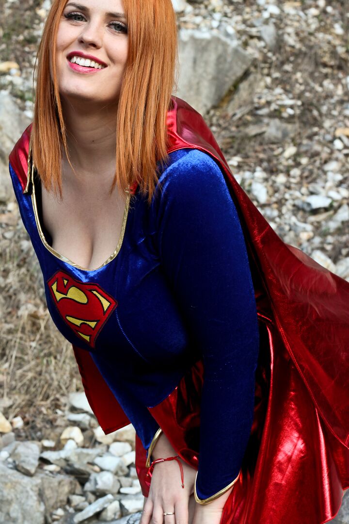 16P Thick redhead Alexsis Faye releases her giant tits from Superman osutfit