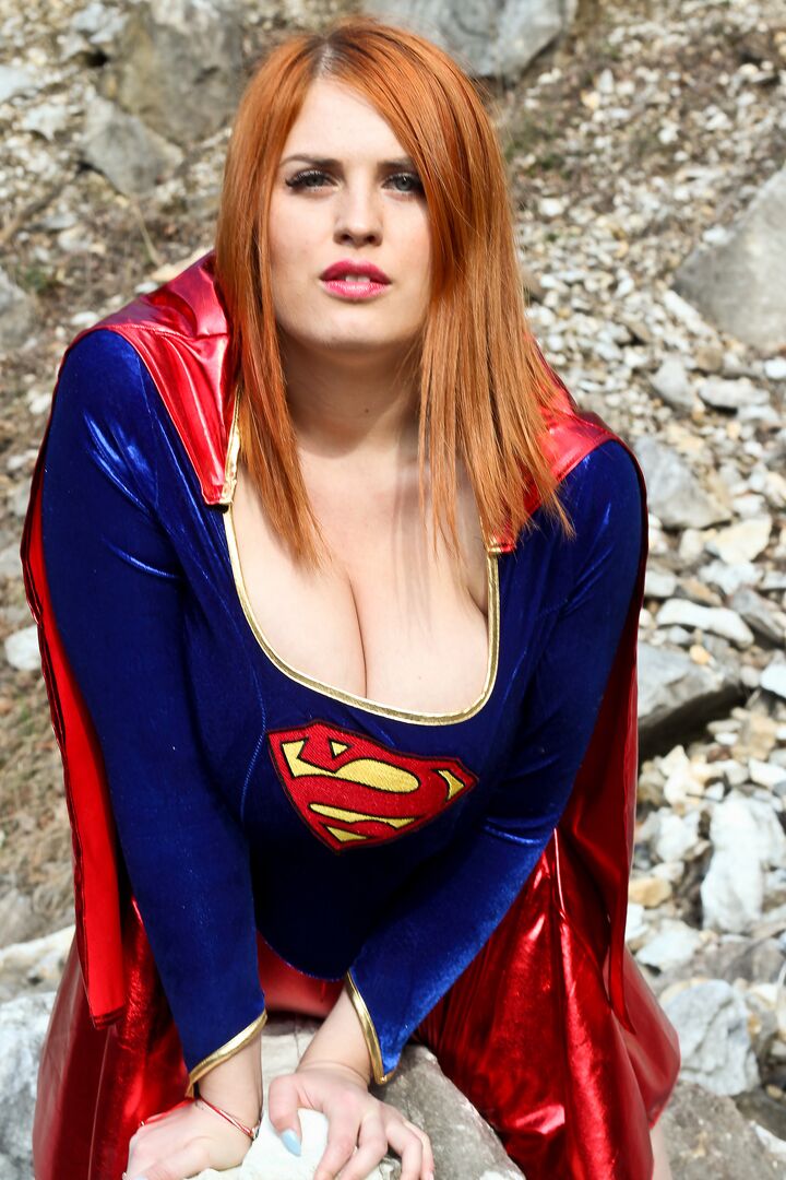 16P Thick redhead Alexsis Faye releases her giant tits from Superman osutfit
