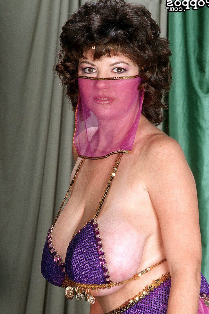 21P Mature belly dancer Diane Poppos reveals her massive juggs in a solo