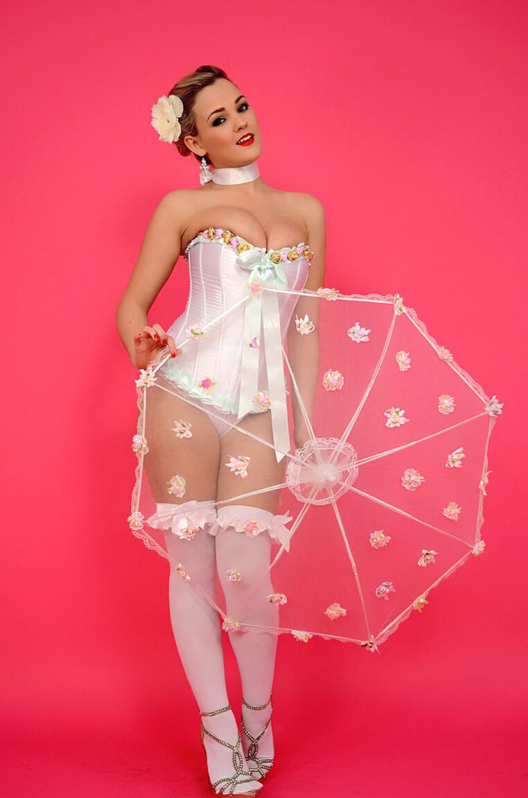 17P Pinup model lets her hair down before freeing her nice tits from a corset