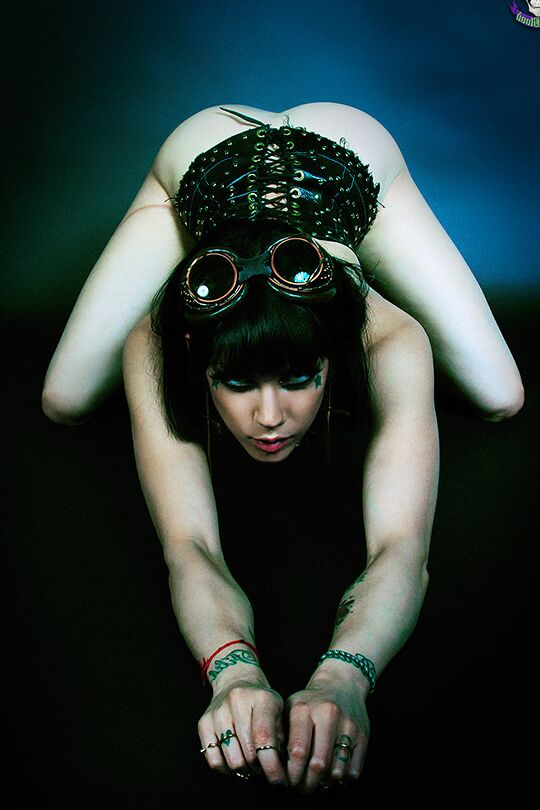 15P Steampunk Goth babe in goggles and sexy corset