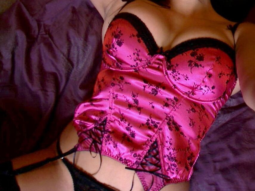 12P Ginas huge tits are almost popping out of her pink corset