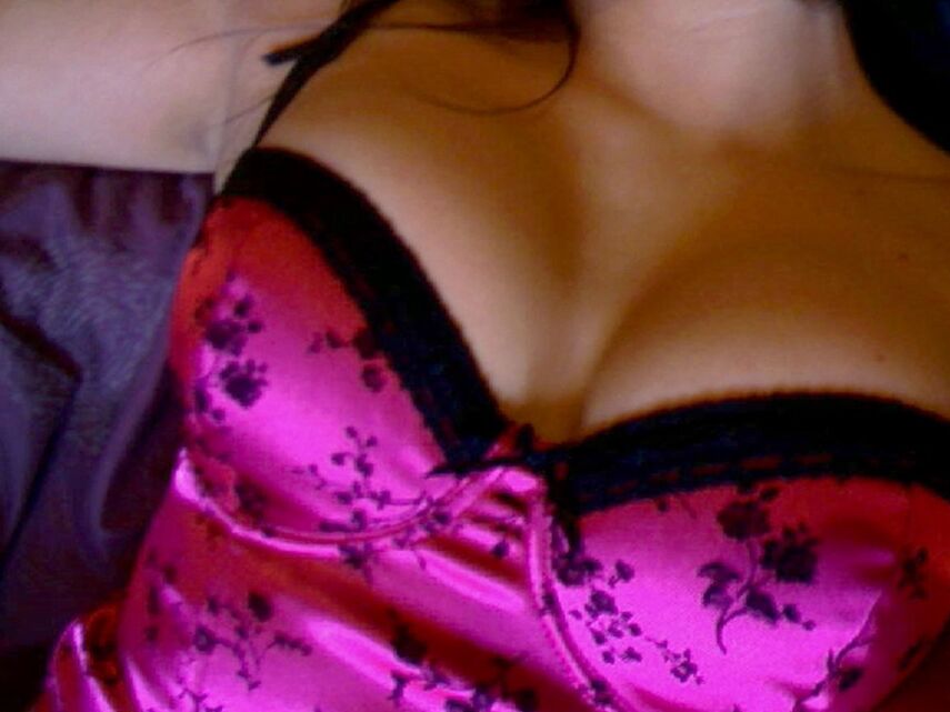 12P Ginas huge tits are almost popping out of her pink corset