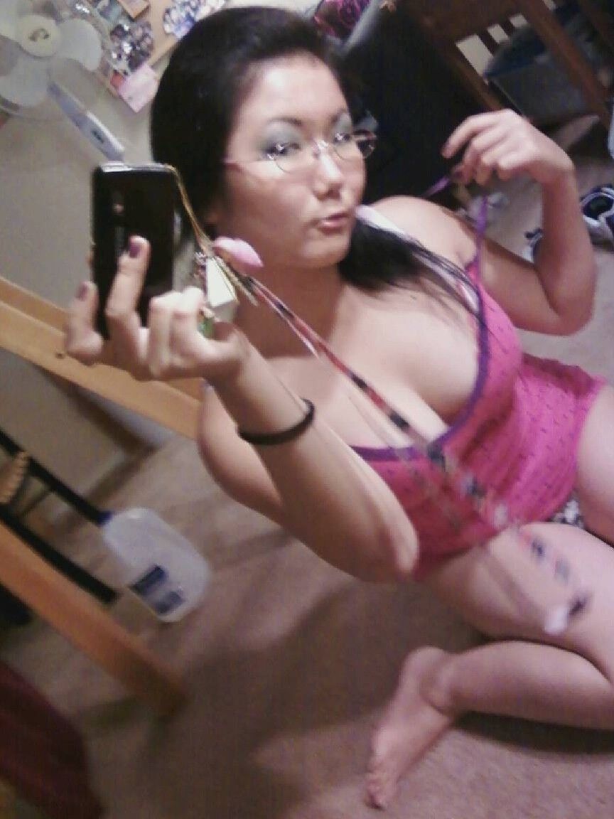 20P Sweet Asian girl with stunning big tits Chiyoko poses in front of a mirror