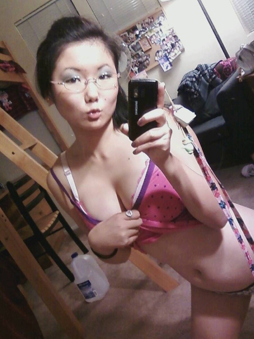 20P Sweet Asian girl with stunning big tits Chiyoko poses in front of a mirror