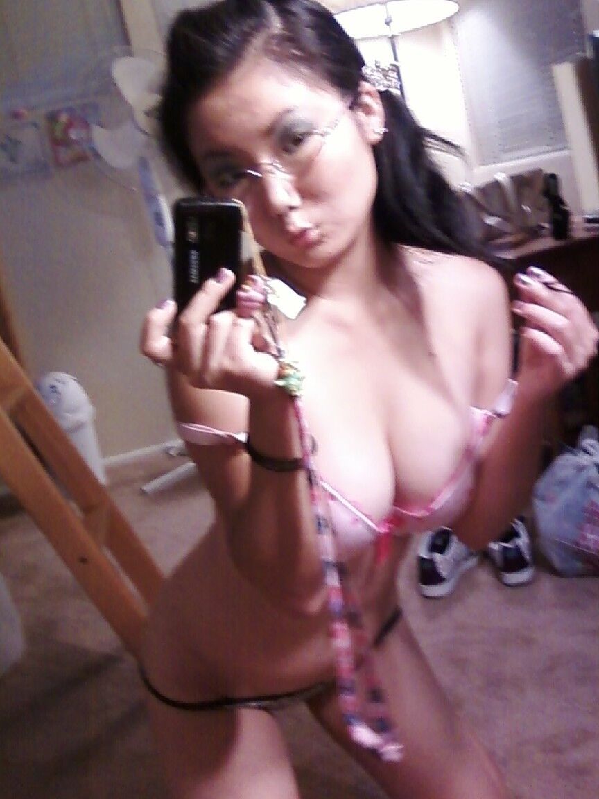 20P Sweet Asian girl with stunning big tits Chiyoko poses in front of a mirror