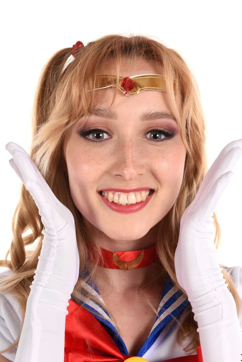 15P Solo girl Kelly Collins prances about in cosplay attire before toying her cunt