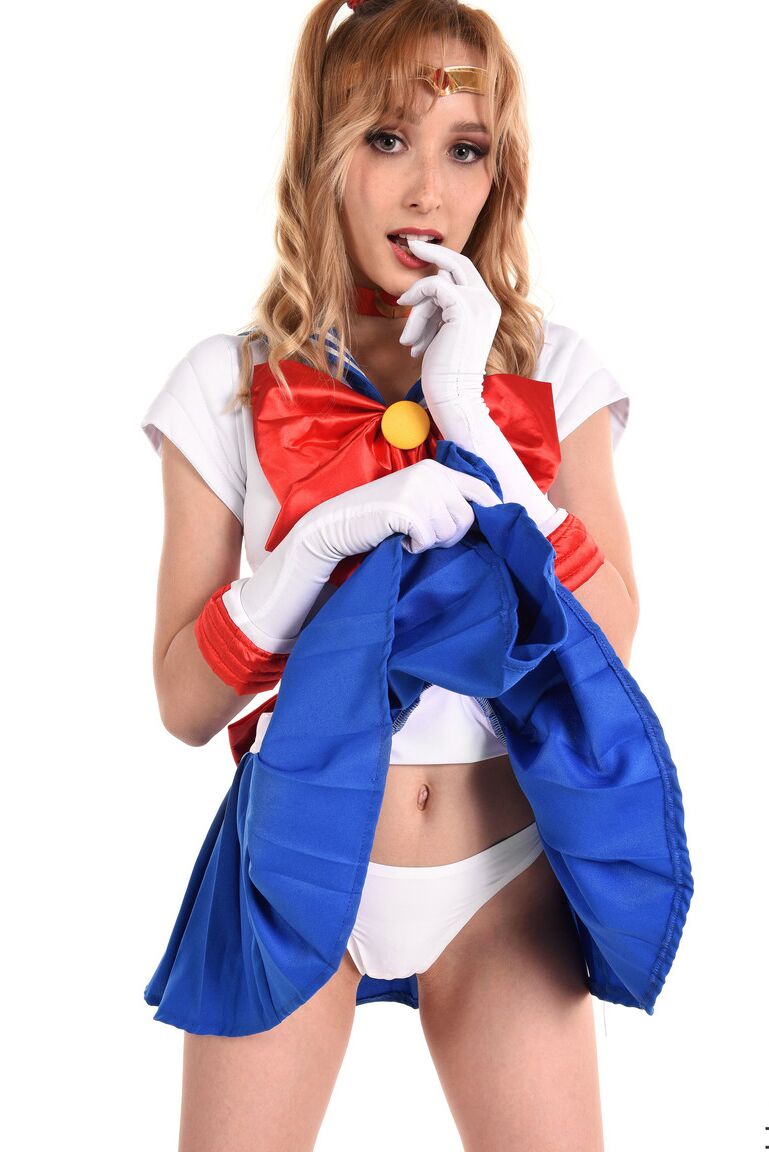 15P Solo girl Kelly Collins prances about in cosplay attire before toying her cunt