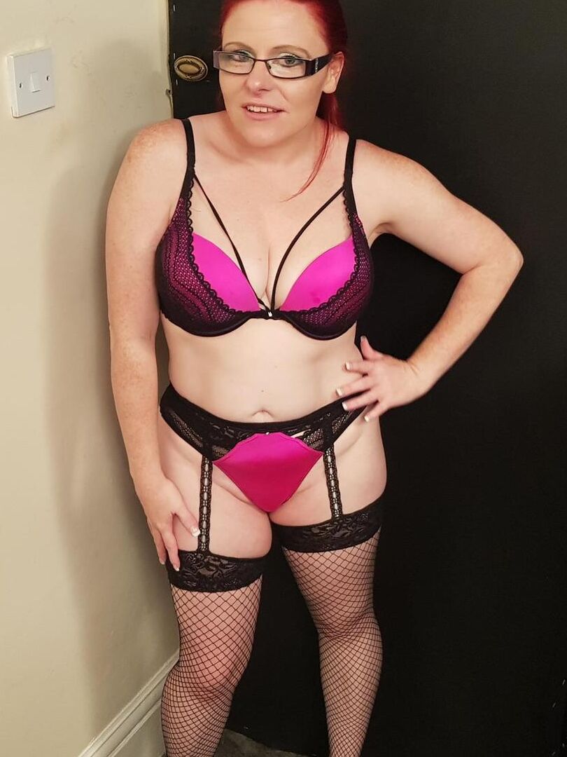16P Middle-aged redhead Mollie Foxxx displays her shaved pussy with her glasses on